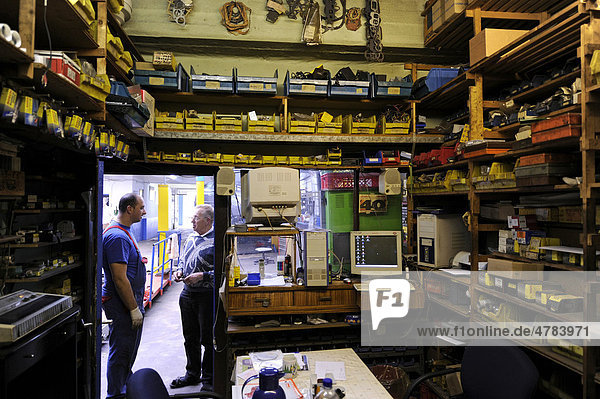 Spare parts stockroom  mechanics at work  garage