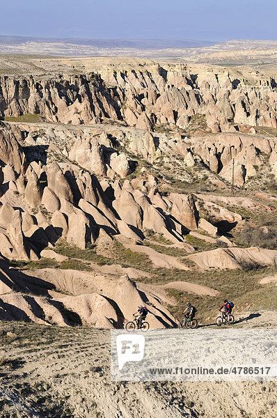 Mountain bikers in the Devrent Valley  Goreme  Cappadocia  Turkey  Western Asia