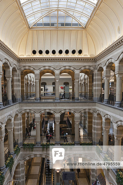 Arcades in the inner courtyard of Magna Plaza shopping centre in the former building of the Main Post Office  Nieuwezijds Voorburgwal  Amsterdam  Holland  Netherlands  Europe