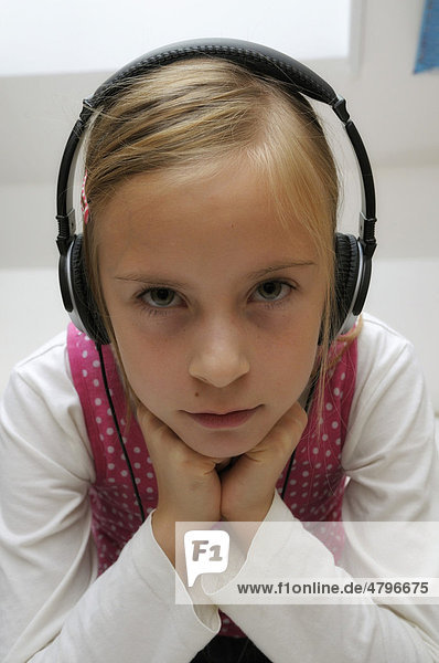 Girl  9 years  with headphones