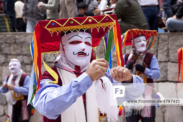 Man wearing a traditional costume at a parade in Aguas Calientes  Peru  South America