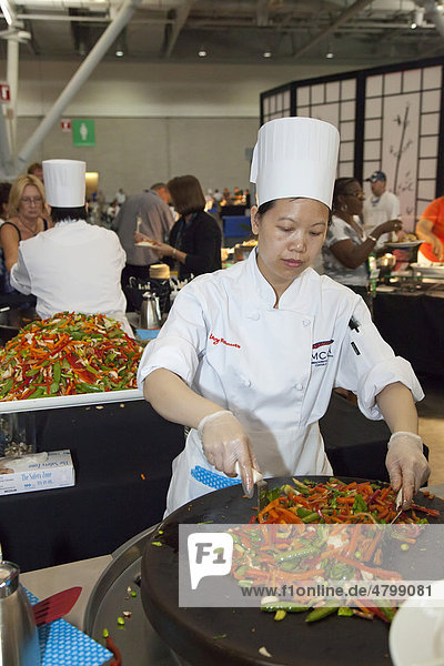 A chef at the Massachusetts Convention Center cooks during a reception for delegates to the convention of the public employees union AFSCME  Boston  Massachusetts  USA
