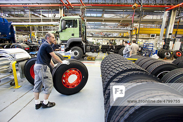Assembly of the tires  production of trucks  Man AG company  Munich  Bavaria  Germany  Europe
