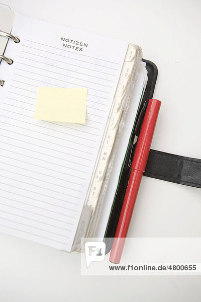 Filofax  diary with notepad and sticky note