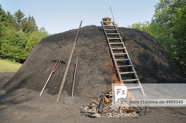 Charcoal kiln is set on fire by charburner  Walpersdorf  Siegen-Wittgenstein  North Rhine-Westphalia  Germany