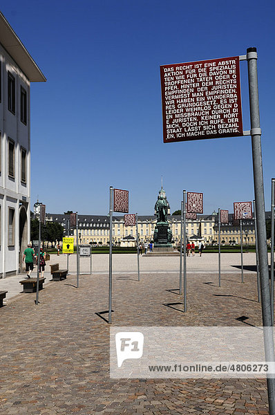 Schilder mit den Grundrechten am Platz der Grundrechte  hinten das Schloss  Karlsruhe  Baden-Württemberg  Deutschland  Europa