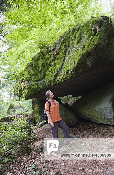 Woman hiking in the nature and rock park Falkenstein  Bavarian Forest  Lower Bavaria  Germany  Europe