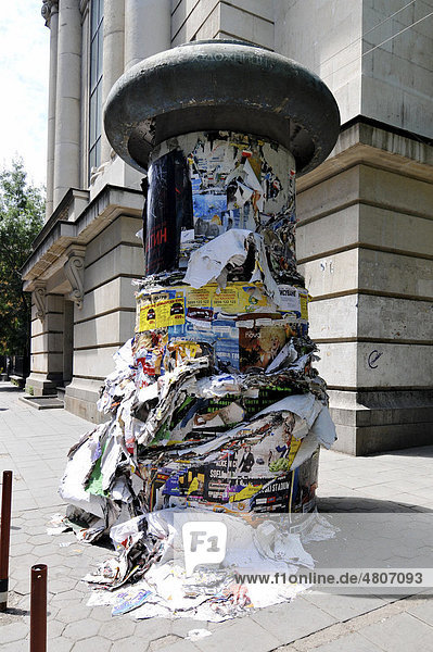 Advertising pillar with many pulled down posters  Sofia  Bulgaria  Europe