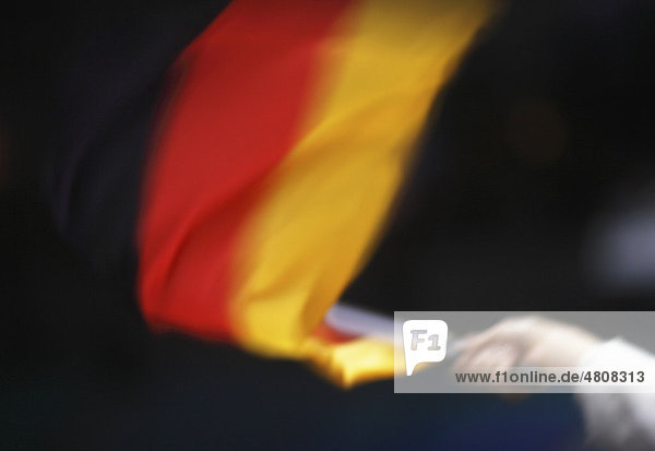 Hand mit Deutschlandflagge