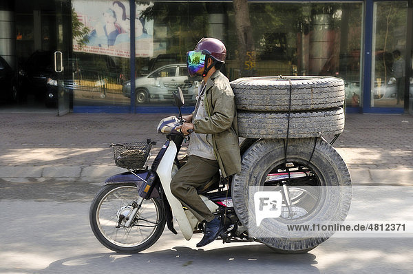 Scooter loaded with tires  Hanoi  Vietnam  Southeast Asia