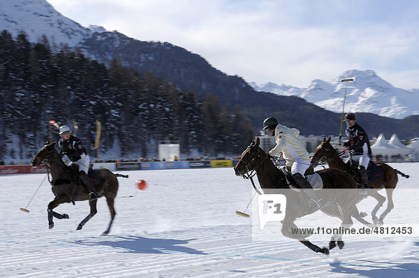 Polo players chasing the ball  Team Brioni against Team Maserati  26. St. Moritz Polo World Cup on Snow  St. Moritz  Upper Engadin  Engadin  Grisons  Switzerland  Europe