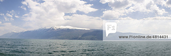 Lake Garda with the snowy peaks of Mount Baldo  Lombardy  Italy  Europe