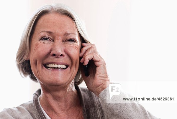 Senior woman on the phone  smiling