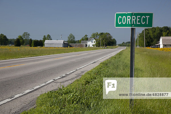 A road sign tells drivers they are arriving in the small town of Correct  Indiana  USA