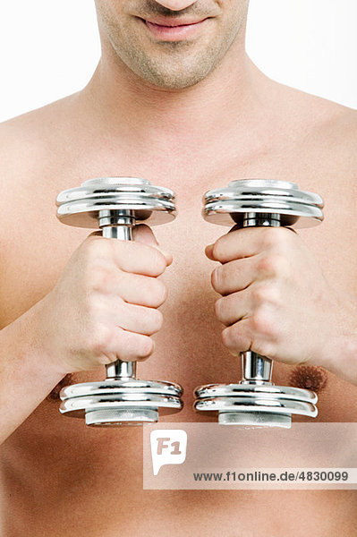 Young man with hand weights