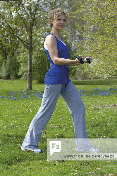 Woman with dumbells