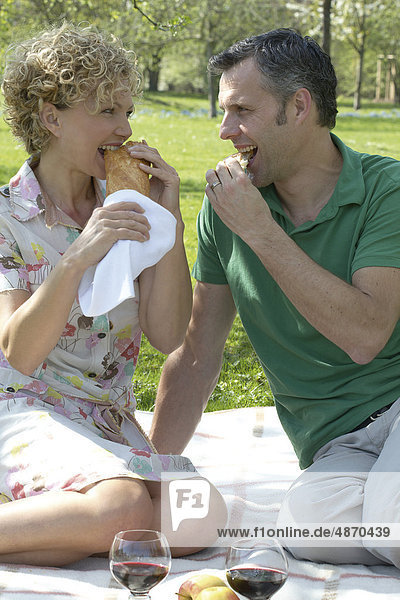 Mature couple having a picnic