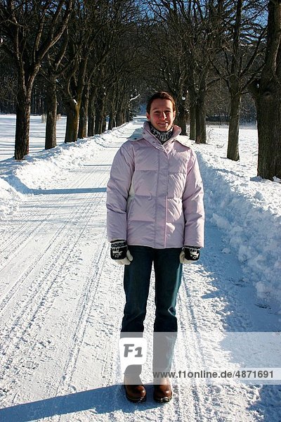 woman on snowy road in winter