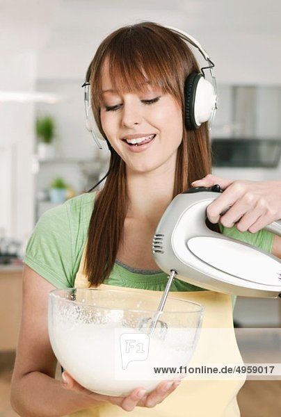 Woman mixing batter in bowl