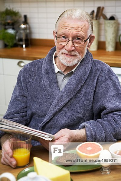 An elderly man having breakfast  Sweden.