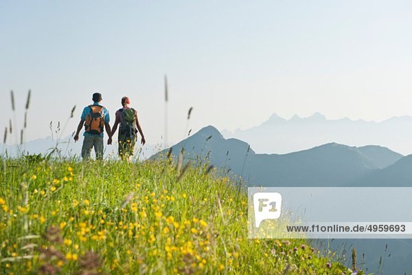 Austria  Salzburg Country  Altenmarkt-Zauchensee  Couple hiking on mountains of Niedere Tauern