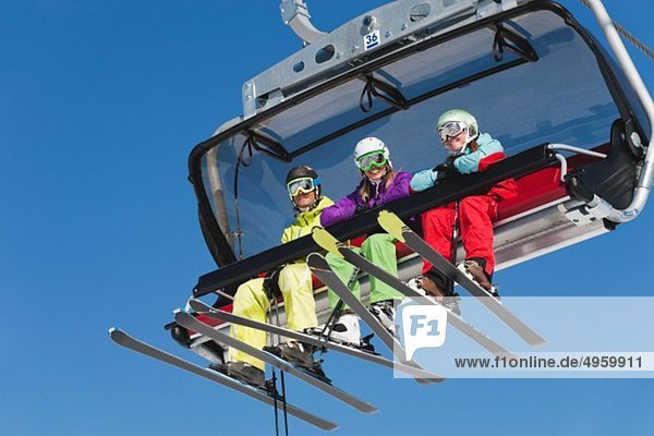 Italy  Trentino-Alto Adige  Alto Adige  Bolzano  Seiser Alm  Group of skiers using ski lift