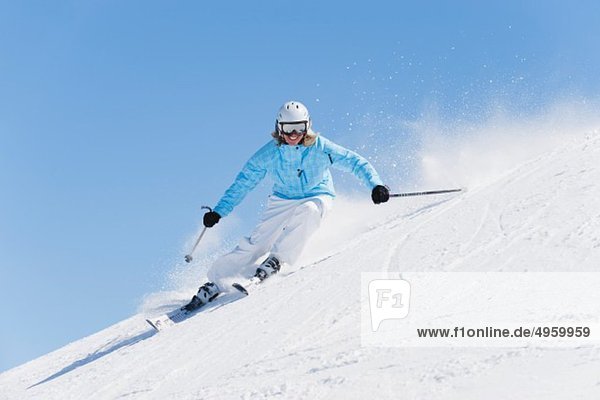 Italy  Trentino-Alto Adige  Alto Adige  Bolzano  Seiser Alm  Young woman skiing