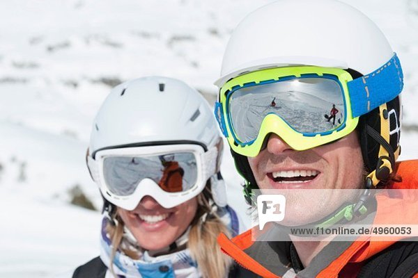 Austria  Kleinwalsertal  Couple wearing skiwear  smiling