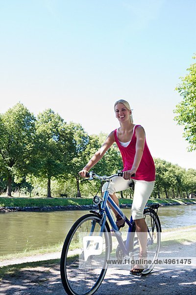 A woman riding a bike  Sweden.