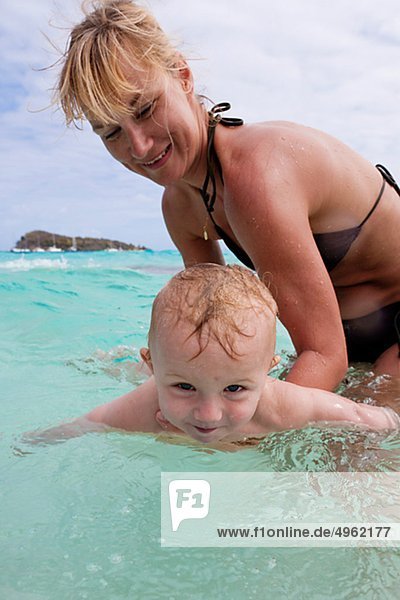 Mother and son playing in Caribbean Sea