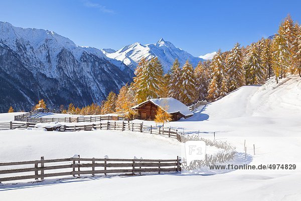 Winterly alpine cabin near Heiligenblut Grossglockner in the background Alps Austria