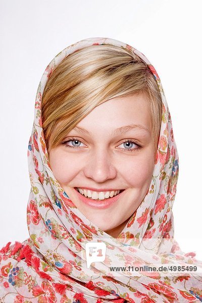 Smiling Young Blond Woman with Scarf around her Head