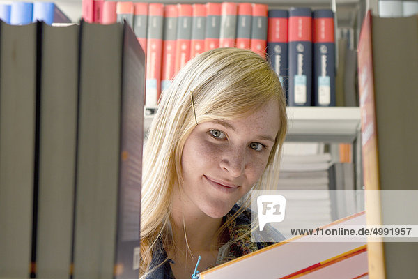 Female student in university library  Darmstadt  Hesse  Germany