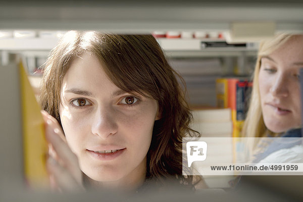 Female student in university library  Darmstadt  Hesse  Germany