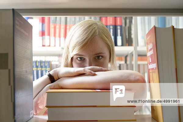 Female student in university library  Darmstadt  Hesse  Germany