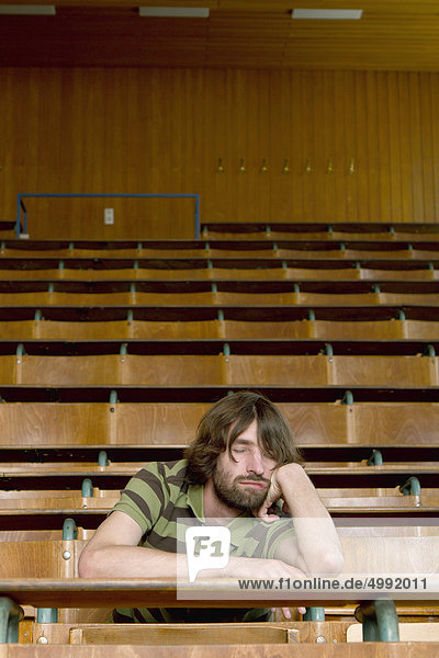 Male student in lecture theatre  Darmstadt  Hesse  Germany