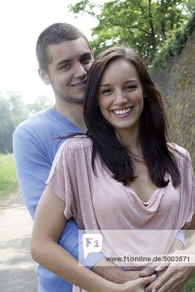 Smiling young couple outdoors