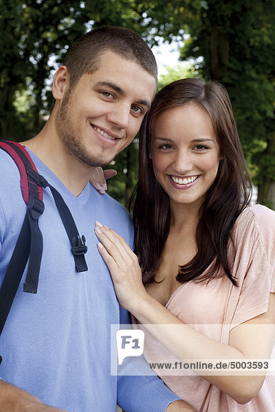 Smiling young couple outdoors