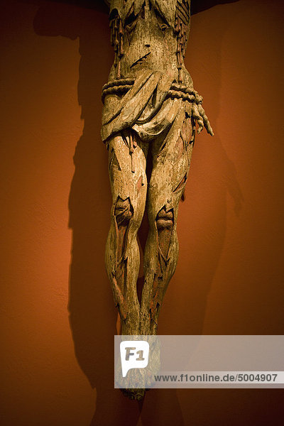 A crucifix statue  waist down