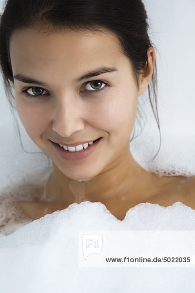 Woman relaxing in bubble bath  portrait