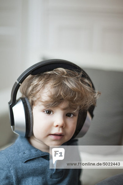 Toddler boy wearing headphones  portrait