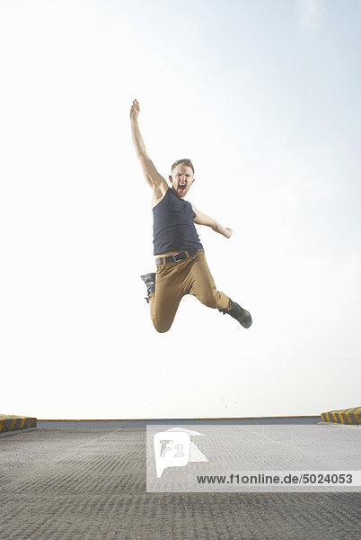 Man jumping in road