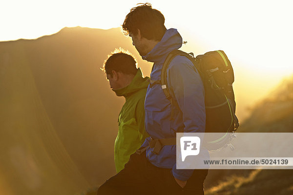 Men hiking on mountainside