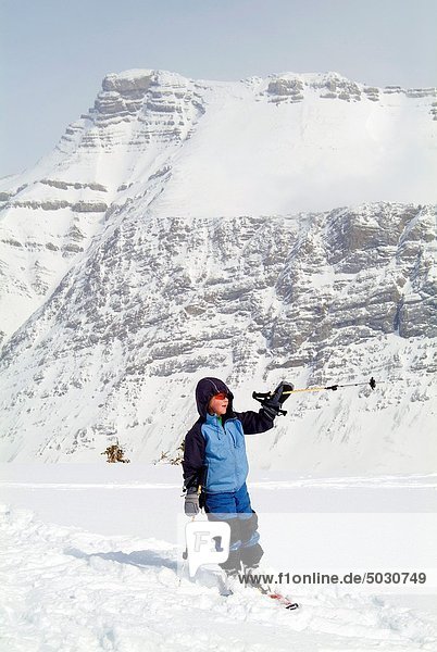 eight year old boy skis in Banff National Park  Alberta  Canada