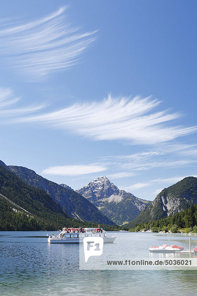 Austria  Tyrol  Tourist in boat on lake plansee near reutte