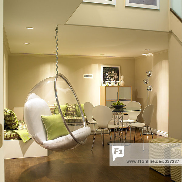 Finished basement with bubble hanging chair and contemporary furniture  Victoria  Vancouver Island  B.C.  Canada