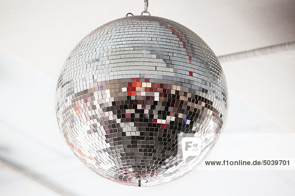 Low angle view of a mirrored disco ball in a nightclub
