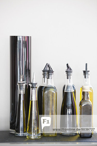 Assorted cooking oil bottles in a restaurant