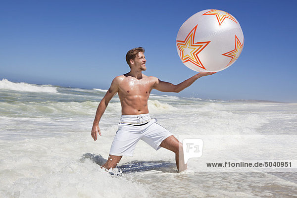 Man playing with beach ball