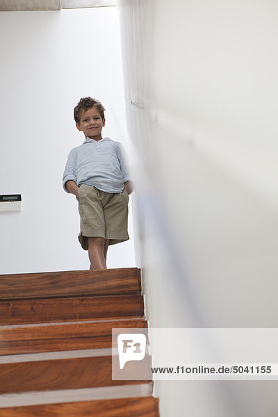 Boy standing on a staircase